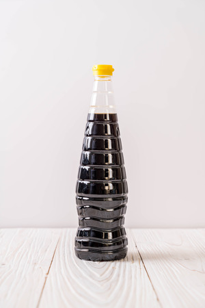 soy sauce bottle on wood backgroundの写真素材