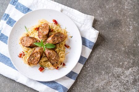 Stir-Fried Spaghetti with Sai Aua (Notrhern Thai Spicy Sausage) - Fusion food styleの写真素材