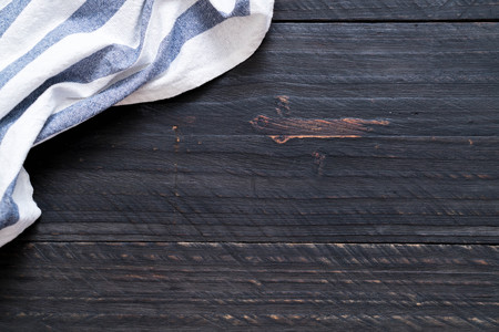 kitchen cloth (napkin) on wood background with copy space