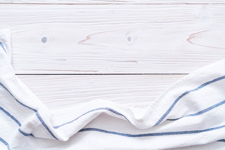 kitchen cloth (napkin) on wood background with copy space