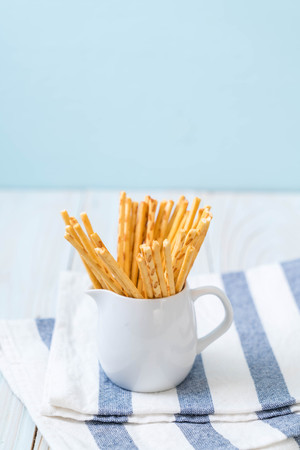 biscuit sticks on wood background