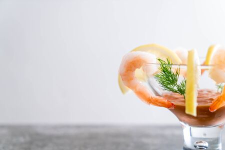 shrimp cocktail with sauce on tableの写真素材