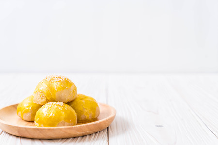 Chinese pastry or moon cake filled with mung bean paste and salted egg yolk - Asian dessertの写真素材