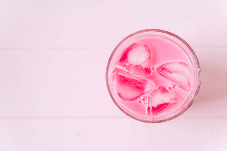 pink strawberry milkshake on woodの写真素材