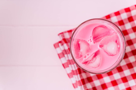pink strawberry milkshake on woodの写真素材