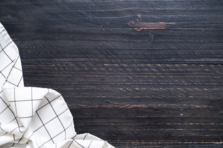 kitchen cloth (napkin) on wood background with copy spaceの写真素材