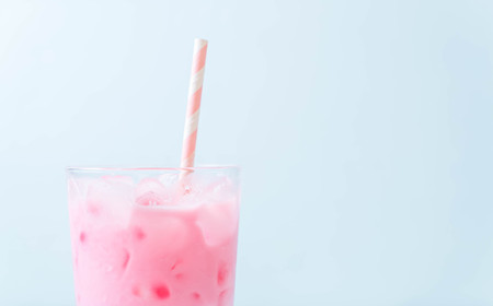 pink strawberry milkshake on woodの写真素材