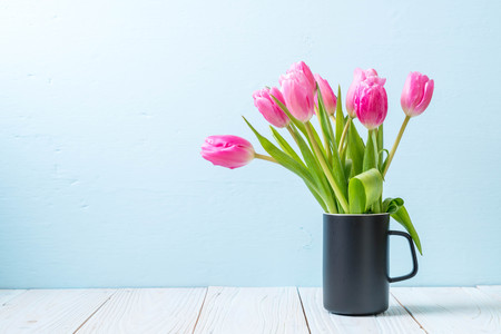 pink tulip flower on wood background with copy spaceの写真素材