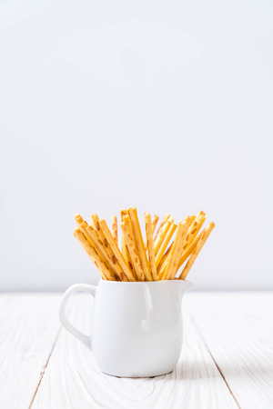 biscuit sticks on wood backgroundの写真素材