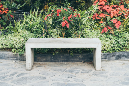 empty bench in home garden - vintage effect filterの写真素材