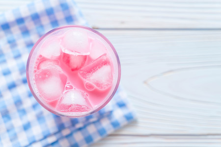 pink strawberry milkshake on woodの写真素材