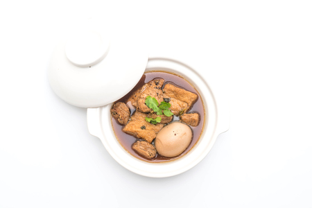 hard-boiled eggs in the sweet gravy with tofu isolated on white backgroundの写真素材