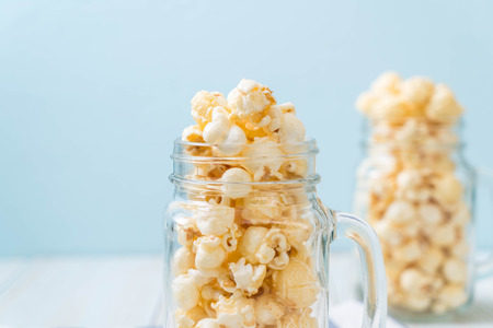 sweet popcorn on wood backgroundの写真素材