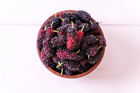 fresh mulberry bowl on wood table