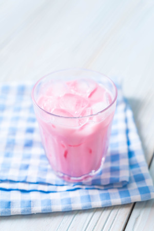 pink strawberry milkshake on woodの写真素材