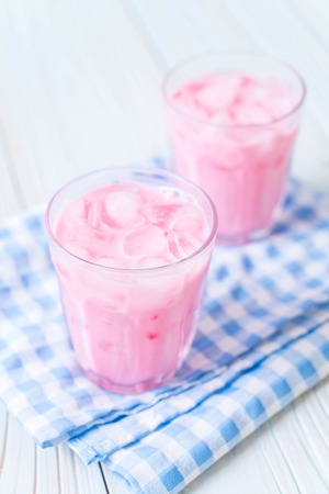 pink strawberry milkshake on woodの写真素材
