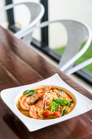 spicy spaghetti with shrimp (tom yum kung) - fusion food styleの写真素材