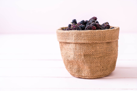 fresh mulberry bowl on wood tableの写真素材