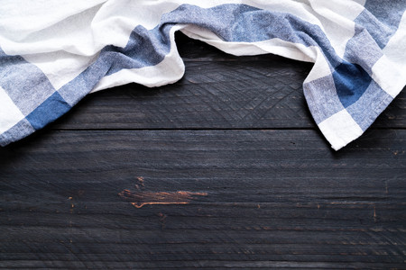 kitchen cloth (napkin) on wood background with copy spaceの写真素材