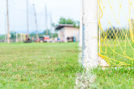 A soccer goal on green empty football fieldの写真素材