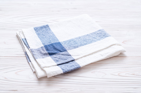 kitchen cloth (napkin) on wood background with copy space