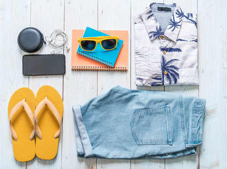 men's casual outfits of traveler, summer holiday on wood backgroundの写真素材