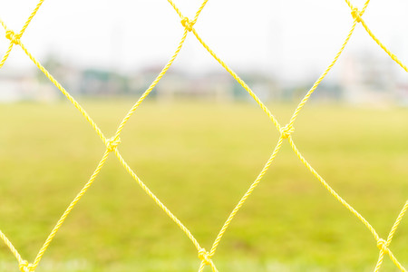 A soccer goal on green empty football fieldの写真素材