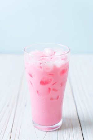 pink strawberry milkshake on woodの写真素材