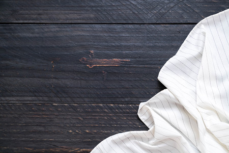 kitchen cloth (napkin) on wood background with copy spaceの写真素材