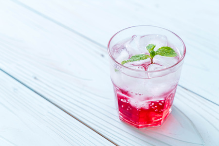 iced strawberry soda on wood tableの写真素材
