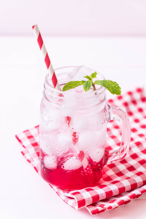 iced strawberry soda on wood tableの写真素材