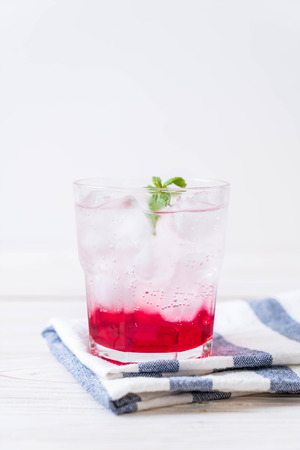 iced strawberry soda on wood tableの写真素材