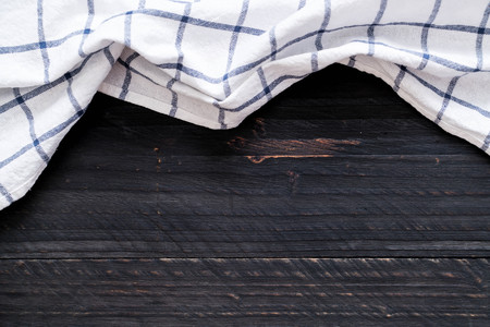 kitchen cloth (napkin) on wood background with copy spaceの写真素材