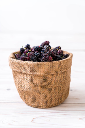fresh mulberry bowl on wood tableの写真素材