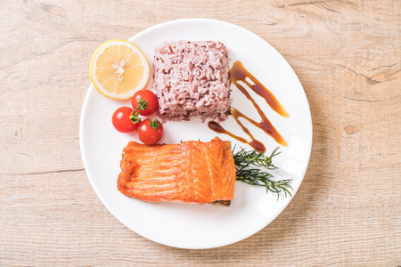 Salmon Steak with Berry Rice on plateの写真素材