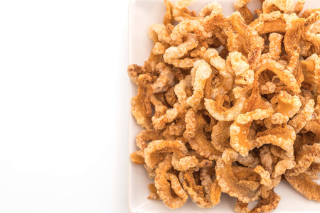 Fried pork rince or Pork snack with Nam Prik Num (Northern Thai Green Chilli Dip) isolated on white backgroundの写真素材