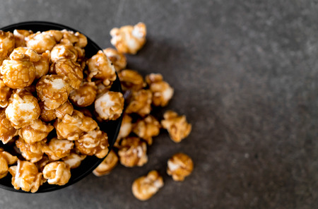popcorn with caramel in bowlの写真素材