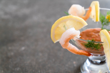 shrimp cocktail with sauce on tableの写真素材