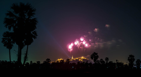 beautiful firework on the sky with temple in Thailandの写真素材