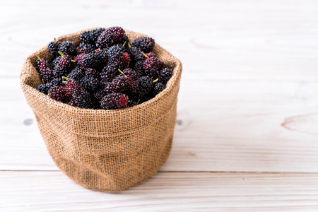 fresh mulberry bowl on wood tableの写真素材