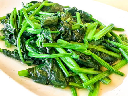 fried spinach on plate - healthy food style