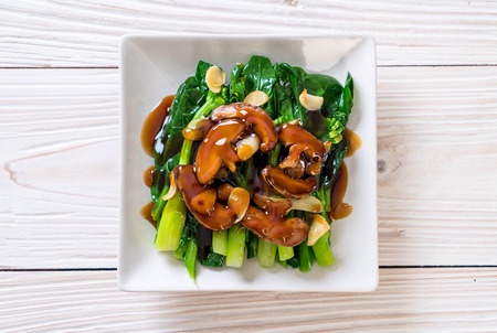 Hong Kong Kale stir fried in oyster sauce with garlicの写真素材