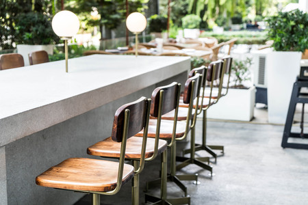 empty chair on outdoor bar in restaurant or coffee shop cafeの写真素材