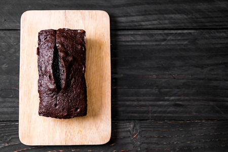 chocolate brownie cake on wood backgroundの写真素材