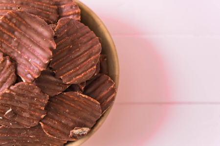 potato chips with chocolate on plateの写真素材