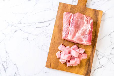 fresh pork raw fillet on wooden boardの写真素材