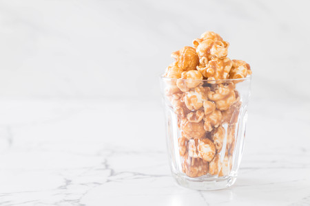 popcorn with caramel in bowlの写真素材