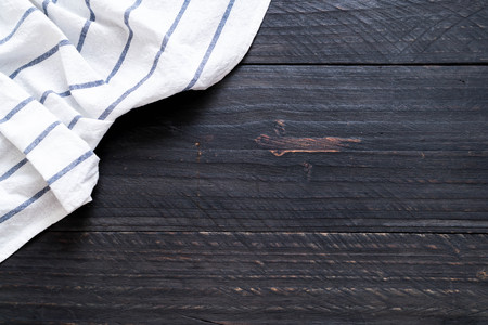 kitchen cloth (napkin) on wood background with copy spaceの写真素材