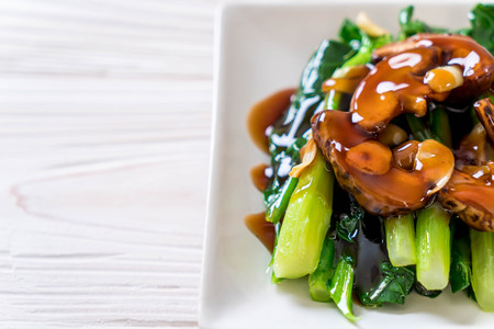 Hong Kong Kale stir fried in oyster sauce with garlicの写真素材