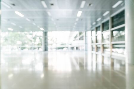 abstract blur and defocused in empty office building with glass window and copy space for background